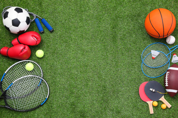 istock Different sport equipment on green grass, flat lay. Space for text 1394228407