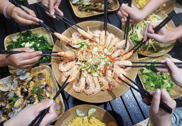 istock Group of hands holding chopsticks 1394228725