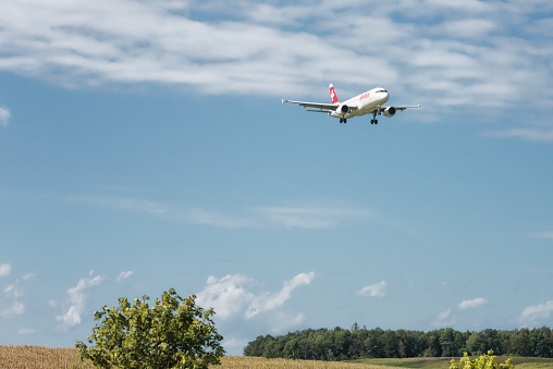 Zurich, Switzerland - August 10, 2019: An Airbus A340 of the Swiss airline Edelweiss Air is landing at Zurich Kloten Airport. The Airbus A340 is a four-engined long-range aircraft of the European aircraft manufacturer Airbus.