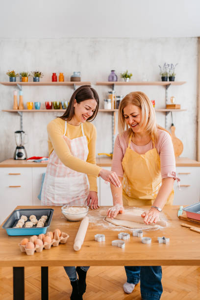 istock Mother And Daughter Baking In The Kitchen 1394228876