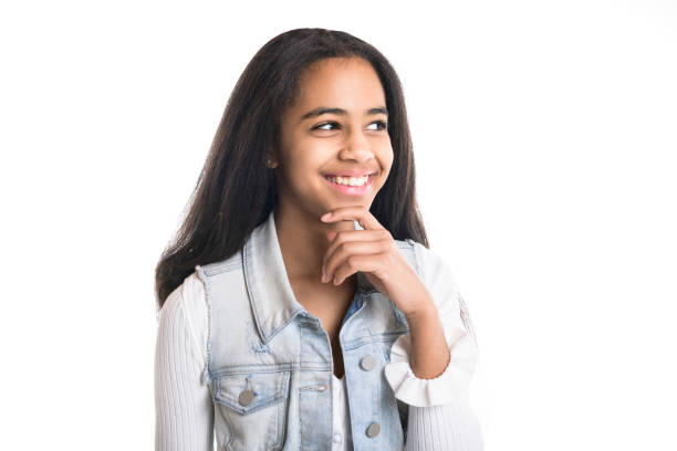 istock Beautiful black teen pensive on studio white background 1394229602