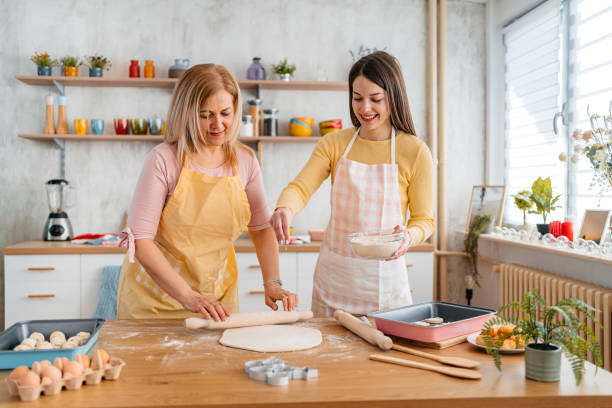 istock Mother And Daughter Baking In The Kitchen 1394229691