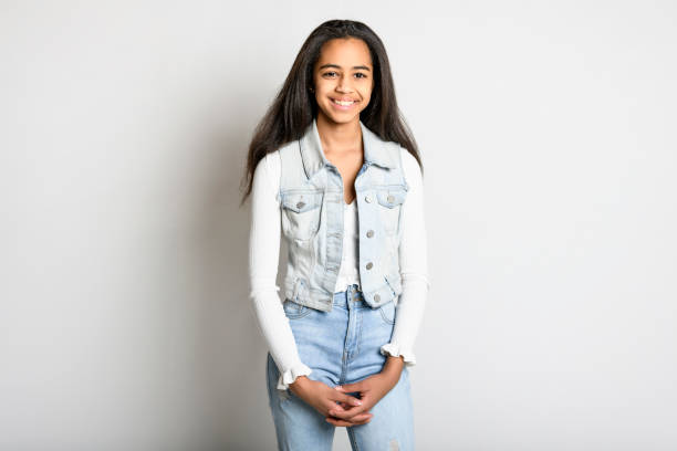 istock Beautiful black teen posing on studio white background 1394229726