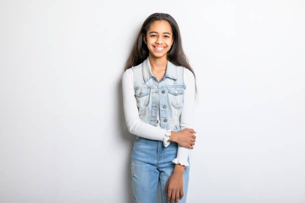 istock Beautiful black teen posing on studio white background 1394229751