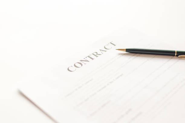 istock Green ballpoint pen on contract documets in office table 1394229952