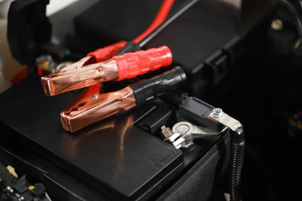 istock Safely charge the car battery with positive-negative terminals. 1394231656