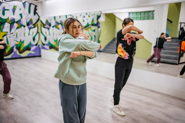 istock Young Women Dancing Hip-hop In A Dance Studio 1394233164