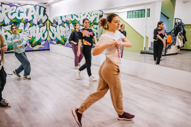 istock Young Women Dancing Hip-hop In A Dance Studio 1394233250