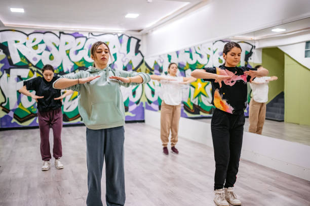 istock Young Women Dancing Hip-hop In A Dance Studio 1394233402