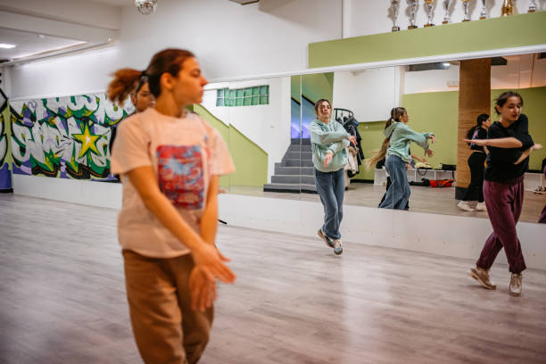 istock Young Women Dancing Hip-hop In A Dance Studio 1394233415