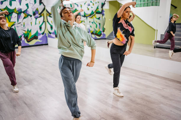 istock Young Women Dancing Hip-hop In A Dance Studio 1394233448