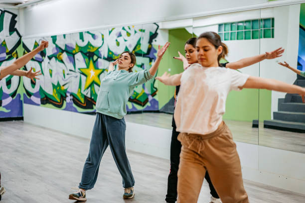 istock Young Women Dancing Hip-hop In A Dance Studio 1394233471