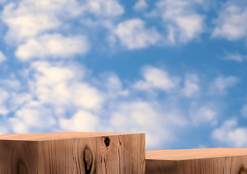 Wooden exhibition podium. 3D Background. Group pedestal with Wood texture. Blue sky and clouds. Stand with Wood texture. 3D rendering