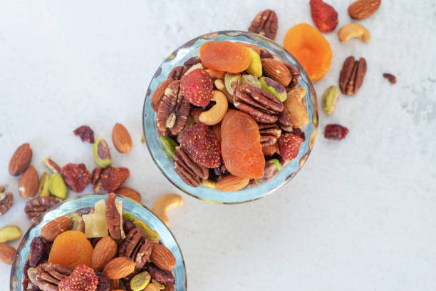 istock mixed nut and dried fruit in glass bowl on 1394239497