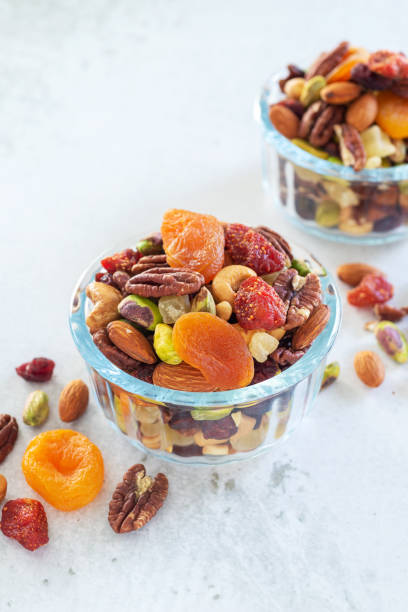 istock mixed nut and dried fruit in glass bowl on 1394239498