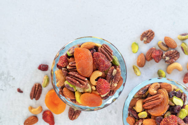 istock mixed nut and dried fruit in glass bowl on 1394239524