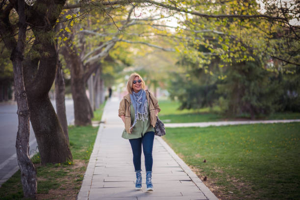 istock Blond Woman walking in fresh air during spring 1394240429