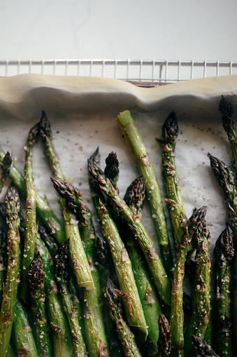 Freshly picked organic asparagus stalks, broiled with olive oil, salt, and pepper to the perfect delicious consistency.  Great food for vegetarians and foodies alike.