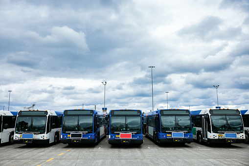 A row of buses currently not in service at the main bus station in Portland, Oregon, USA.