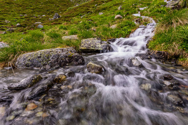 istock A small waterfall flowing into Oberbergbach river in austrian Stubai alps 1394243853