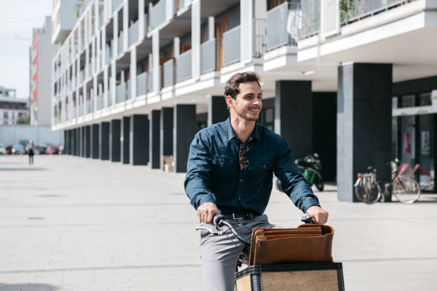 istock young businessman on bicycle 1394244767