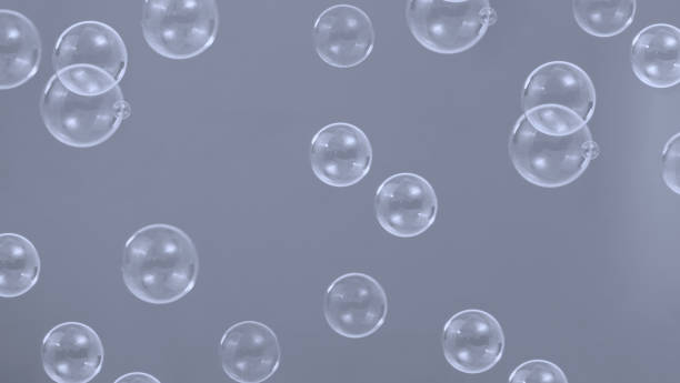 istock Soap bubble drop or Shampoo bubbles floating like flying in the air black background which represent refreshing moments and gentle soft. Bubbles drops for soap  shampoo or detergent product industry. 1394250261