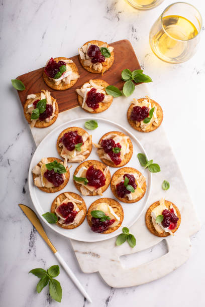 istock Party appetizers with turkey, brie and cranberry sauce 1394250812