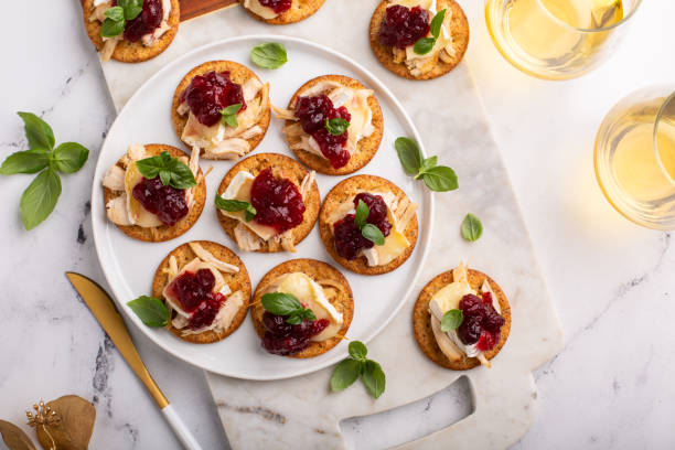istock Party appetizers with turkey, brie and cranberry sauce 1394250814