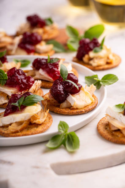 istock Party appetizers with turkey, brie and cranberry sauce 1394250816