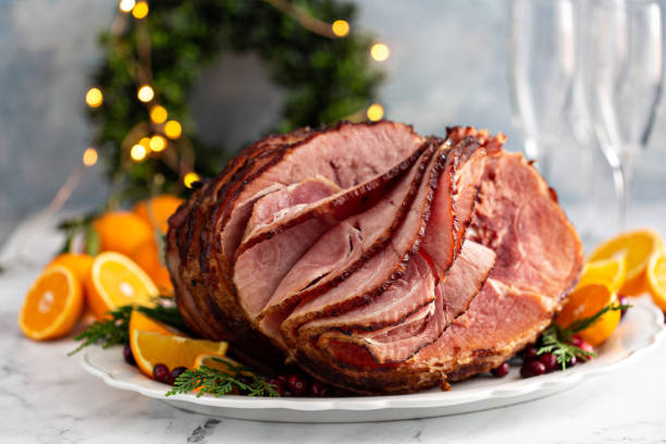 Spiral sliced Christmas ham with orange honey glaze stock photo