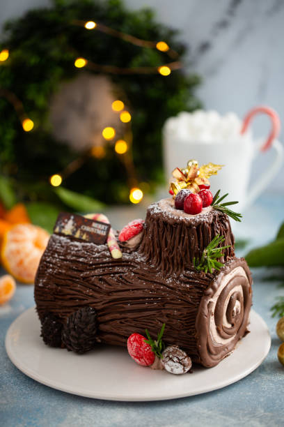 istock Yule log chocolate cake with frosting for Christmas 1394250860