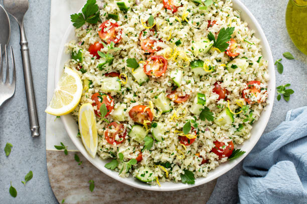 istock Tabbouleh salad with cauliflower rice and vegetables 1394250907