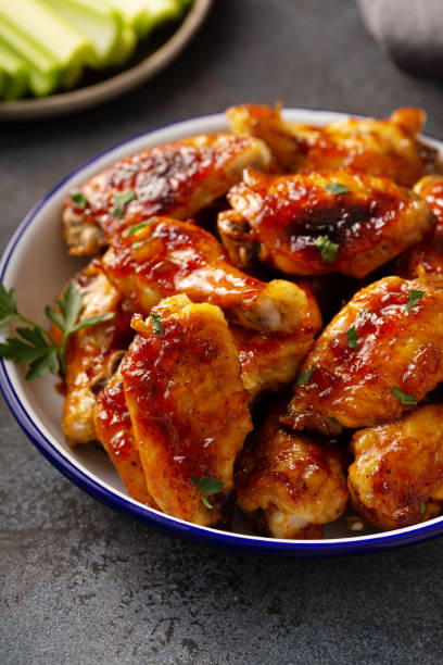 istock Hot sauce glazed chicken wings, roasted or fried 1394250925