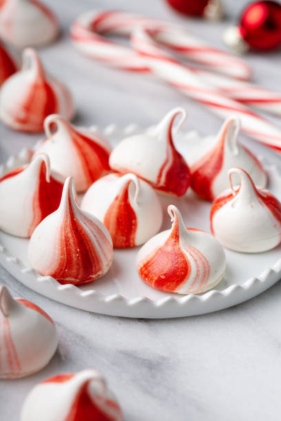 istock Peppermint meringues on a marble table, Christmas treat 1394250935
