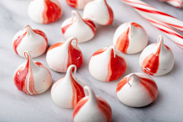 istock Peppermint meringues on a marble table, Christmas treat 1394250937