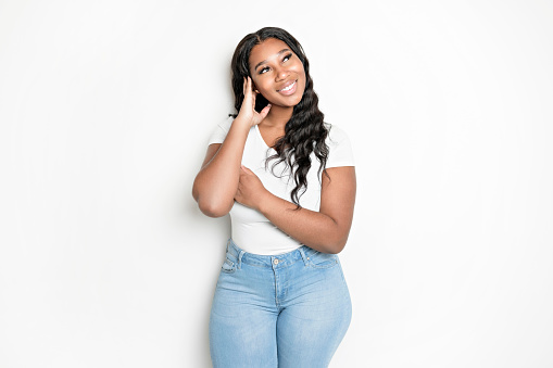 A Studio portrait of beautiful brunette young dark-skinned woman,