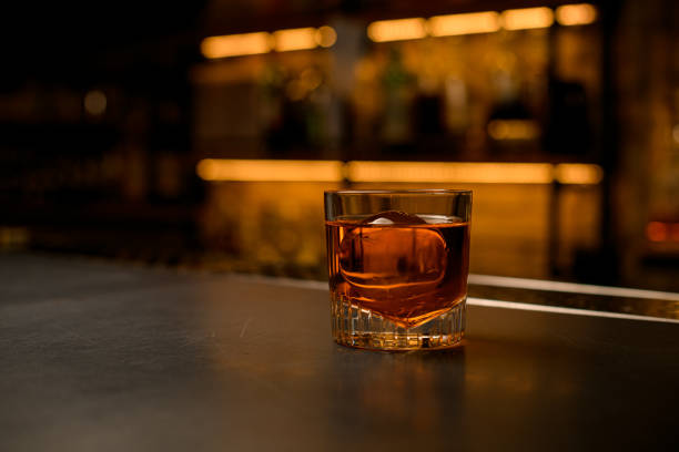 istock view of old-fashioned glass with a bright cold beverage stands on bar 1394252555