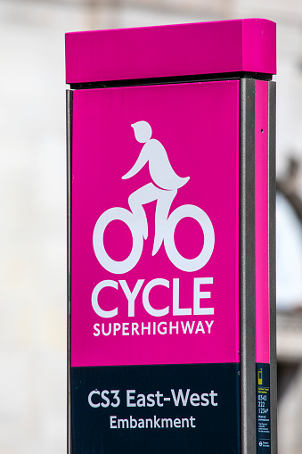 London, UK - April 20th 2022: A sign on the East-West Embankment section of the Cycle Superhighway in central London, UK.