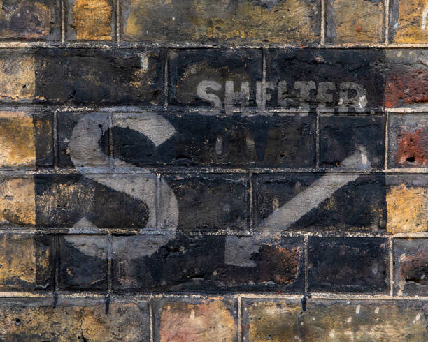 Street name sign on a side of the building on Back Lane, Hampstead, London, UK.