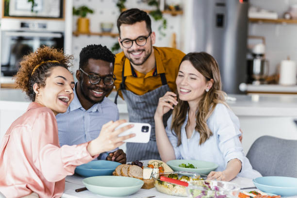 istock Cheerful friends smiling and taking a selfie 1394259821