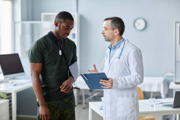 istock Doctor Talking To Military Patient 1394260801