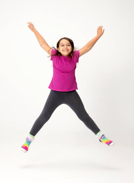 istock Young Girl Jumping 1394264120