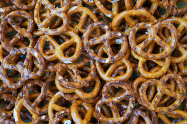 istock Mini pretzels snacks with salt as a background 1394264873