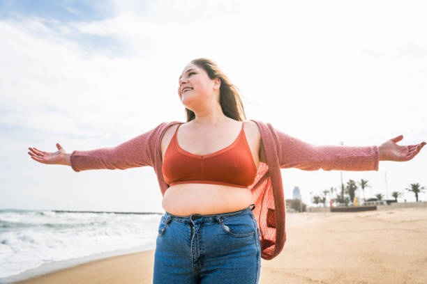 istock Beautiful plus size young woman outdoors 1394266080