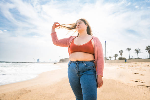 istock Beautiful plus size young woman outdoors 1394267004