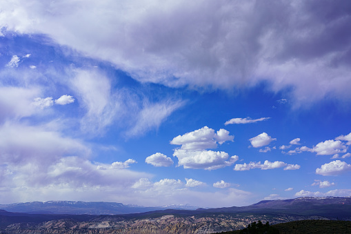 Flat Tops Colorado with Blue Sky and Clouds - Snowcapped mountains with large wide angle sky view.