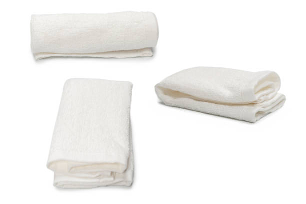 istock White fluffy cotton towel isolated on a white background. 1394270743