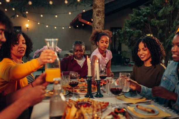 istock Family gathering over dinner in the yard 1394270878