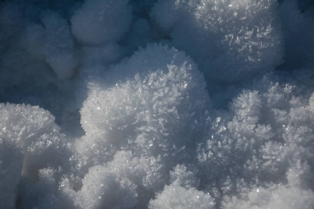 istock Snow surface. Fresh fluffy white snow texture.White snowflakes. 1394271316