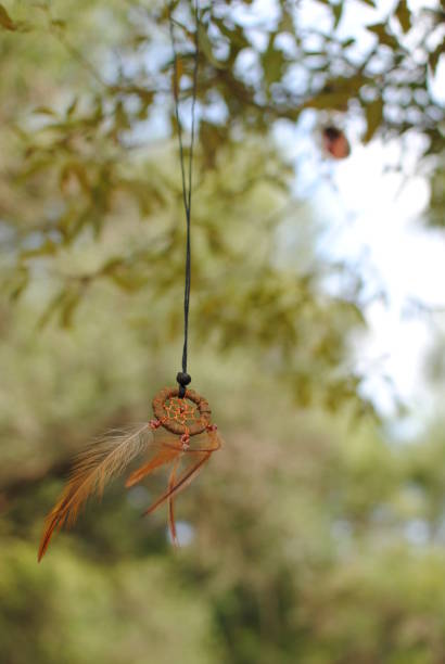 istock Dreamcatcher hanged on a tree branch in nature 1394271981